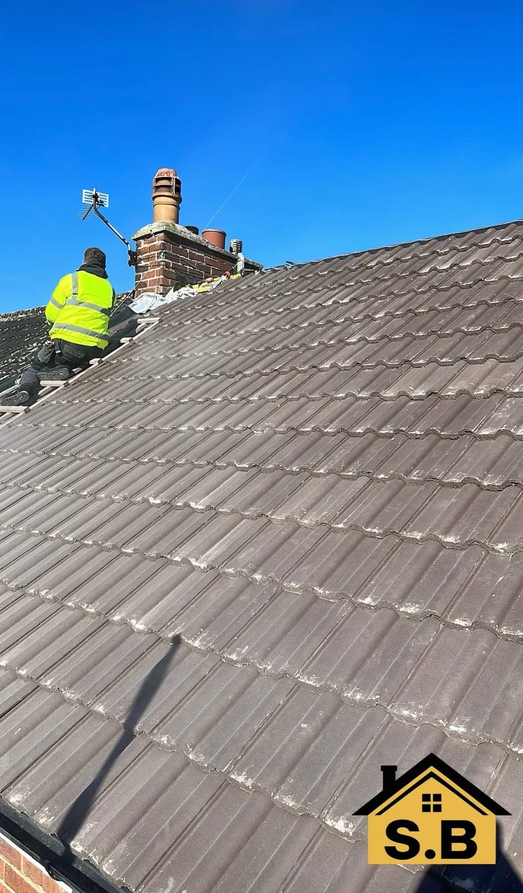 On the roof, with the old tiles still in place