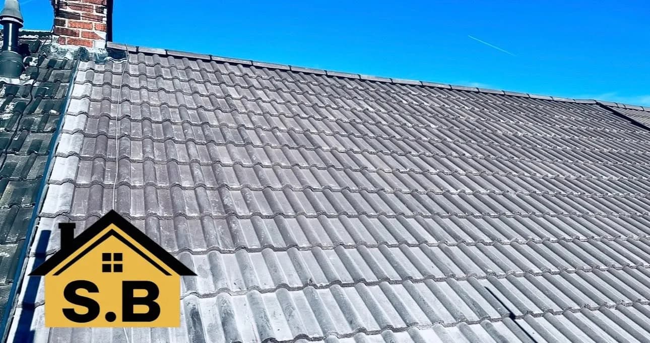 The roof re-tiled, with the chimney stack behind